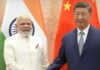 शी जिनपिंग से चीन में मिले पीएम मोदी
